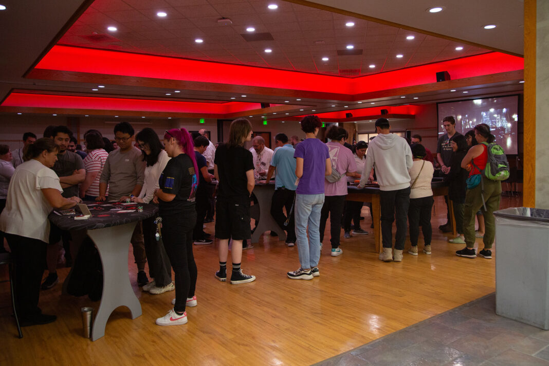 A large crowd participating in an event inside the Student Center