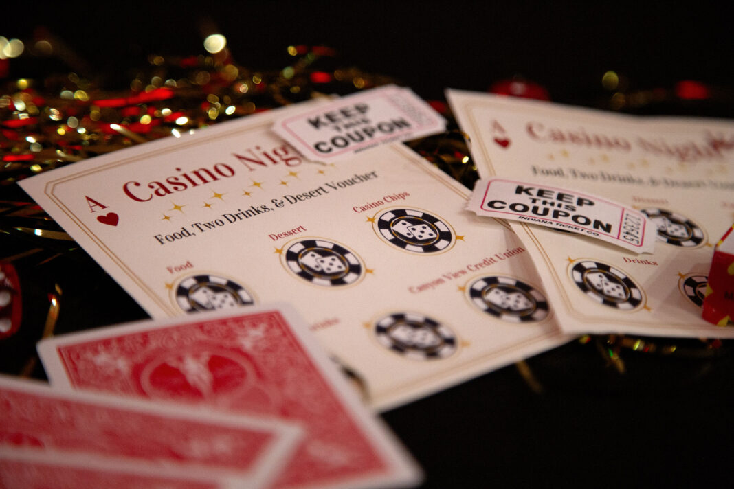 Raffle tickets, playing cards and punch cards sitting on a table