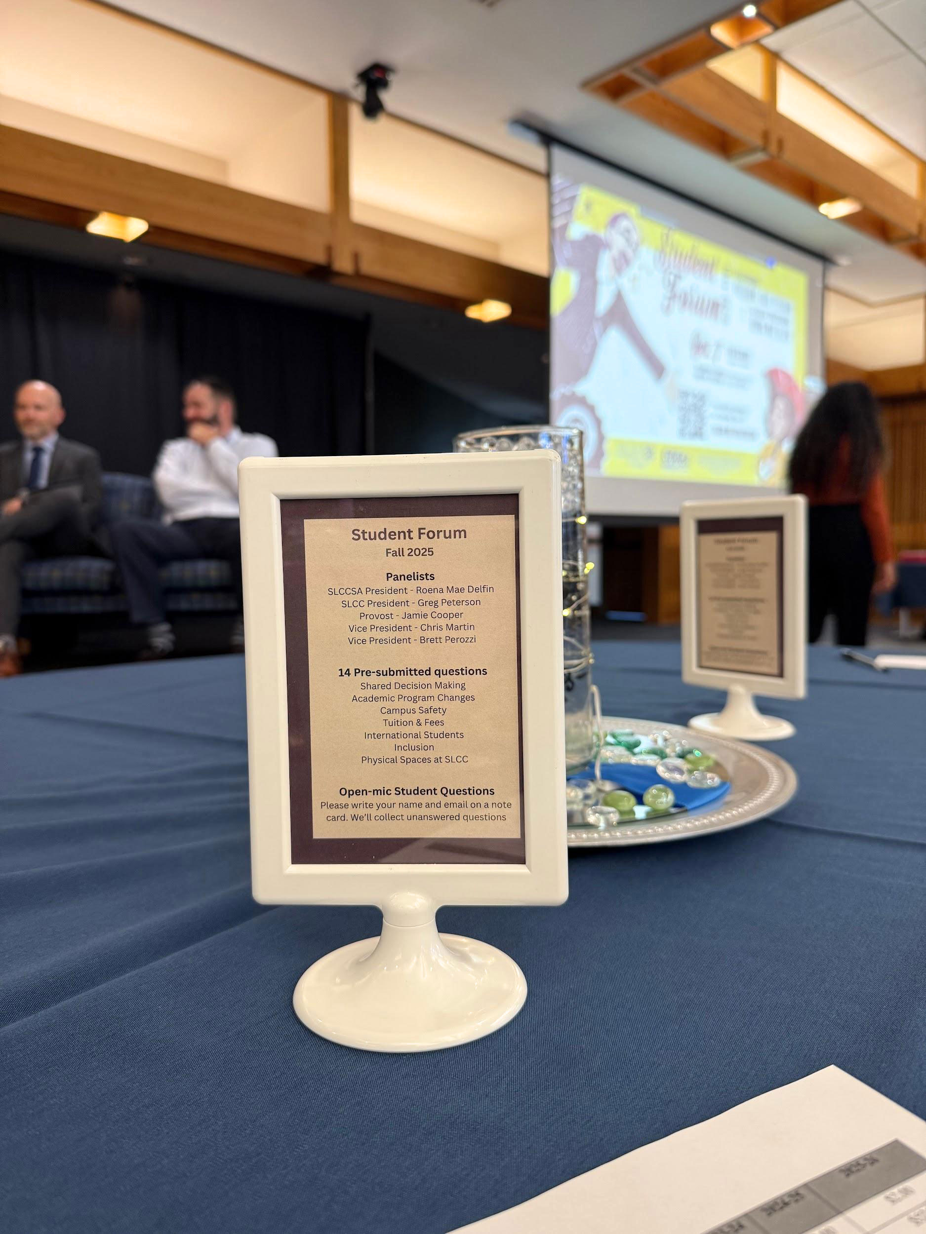 Outline of event information in a placard sitting on a table, in focus
