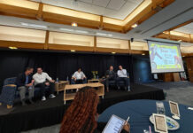 Student forum addresses concerns about tuition, program cuts Panelists sitting in chairs on a riser