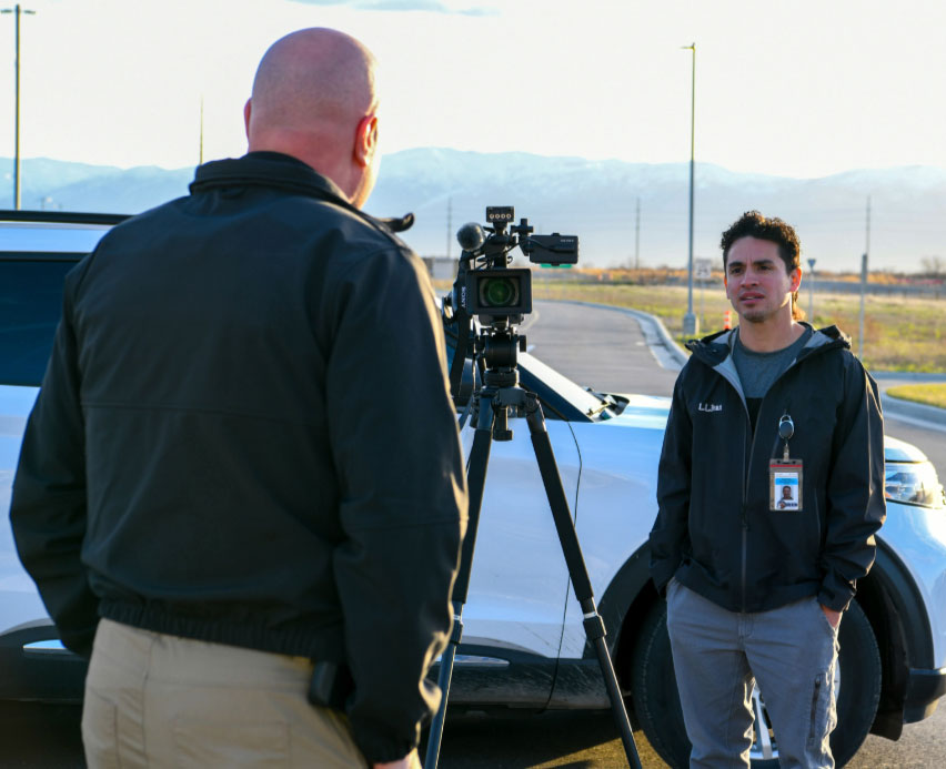 Jesse Valdez interviewing an officer