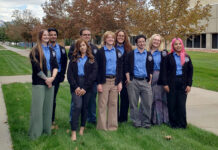 Lactobruins heading to Paris for iGEM science competition Group photo of students wearing blue shirts and blazers