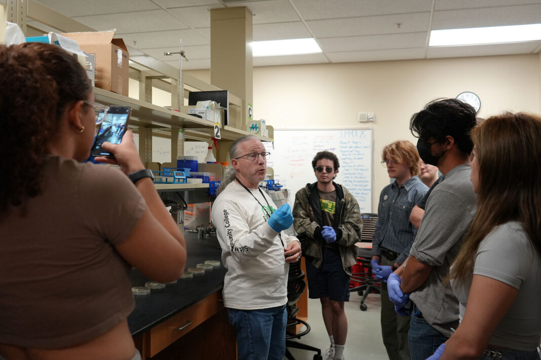 Lane Law explaining lab procedures to students