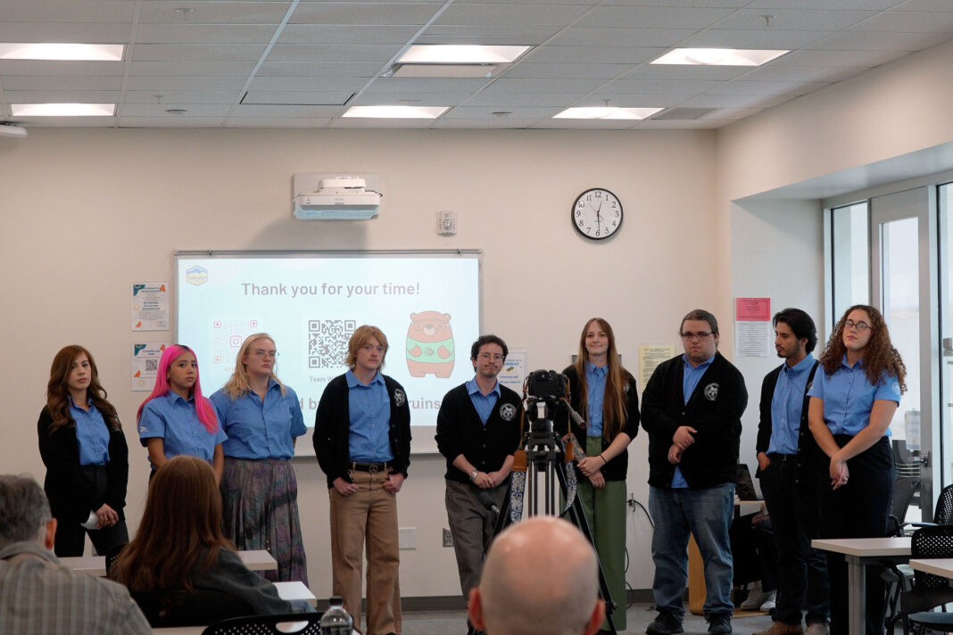 Group of students standing together during a presentation