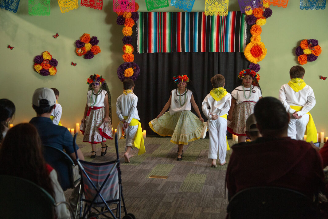Young people dancing in front of an audience