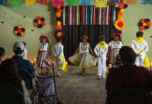 A day of remembrance and celebration Young people dancing in front of an audience