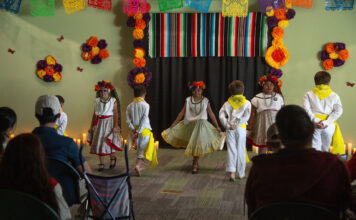 A day of remembrance and celebration Young people dancing in front of an audience