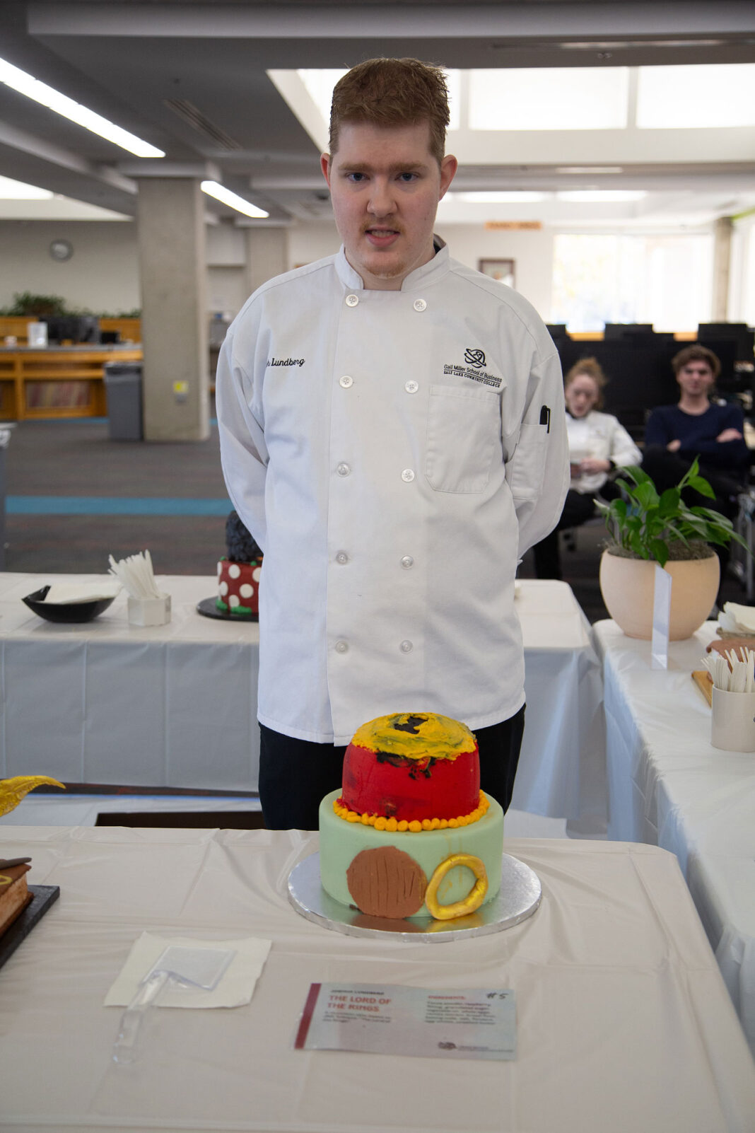 Joshua standing behind his winning cake design