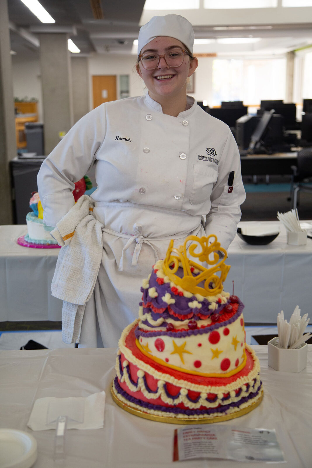 Hannah standing behind her winning cake design