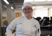 Photos: Edible Books Contest mixes creativity, literacy Hannah standing behind her winning cake design