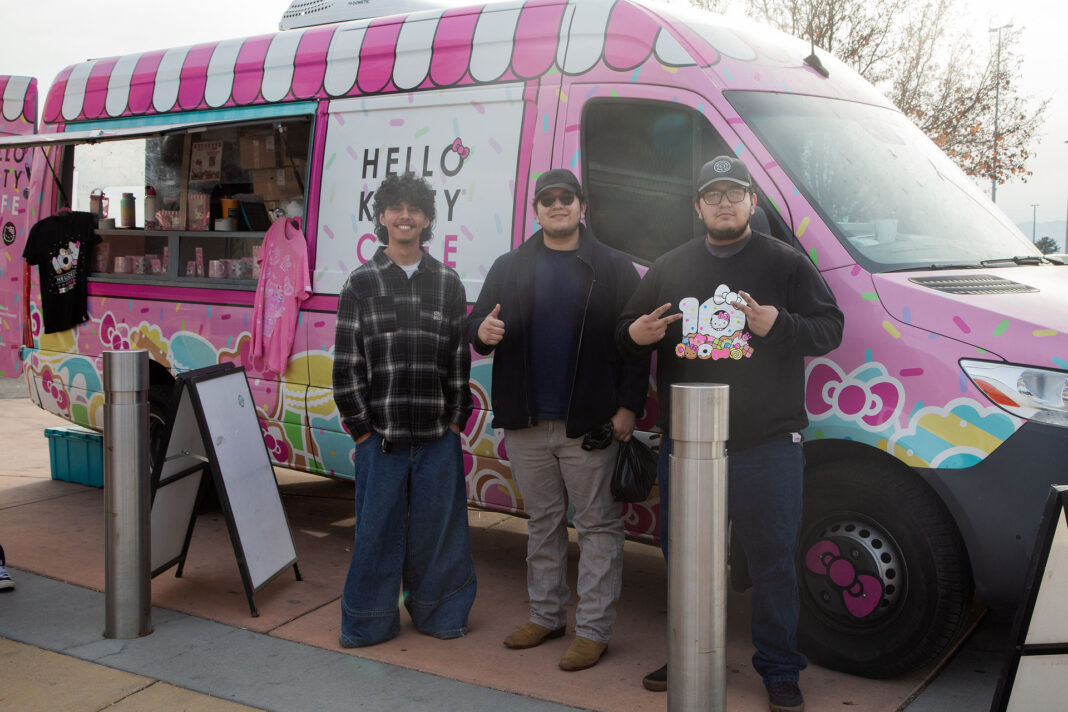 Three patrons standing by the Hello Kitty Cafe Truck
