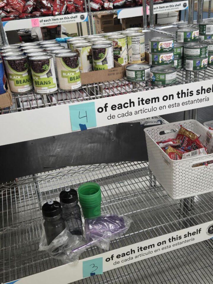 Canned goods and household items sitting on pantry shelves