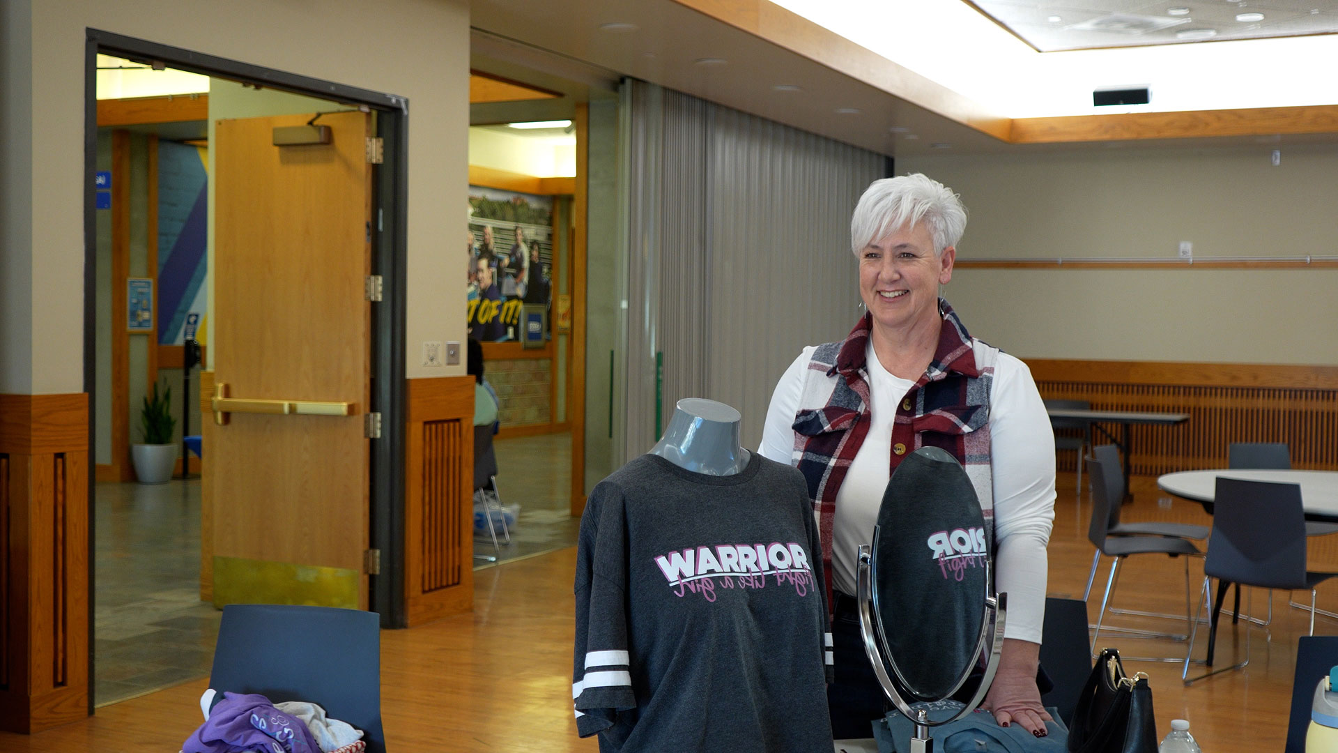 Lori smiling while talking about her shirt designs