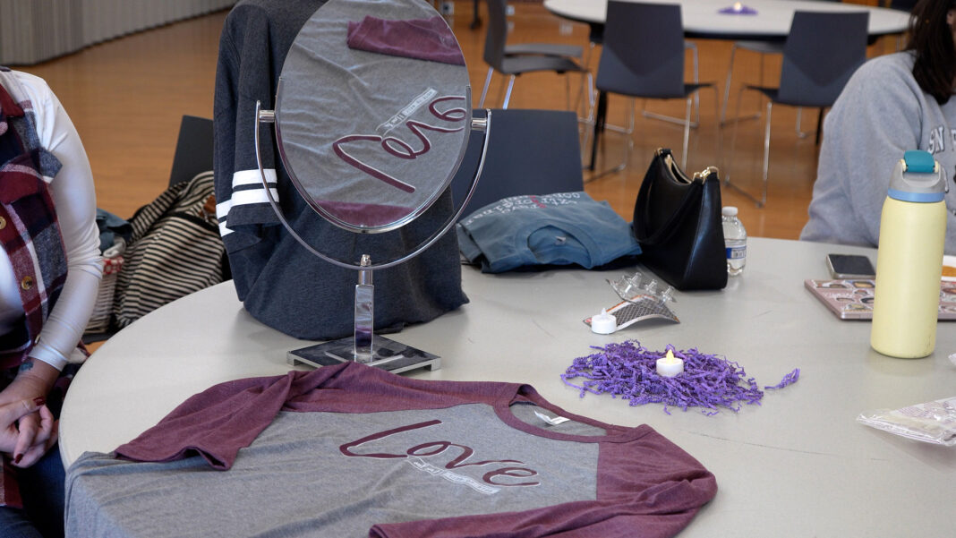 Mirror showing the reflection of a shirt design