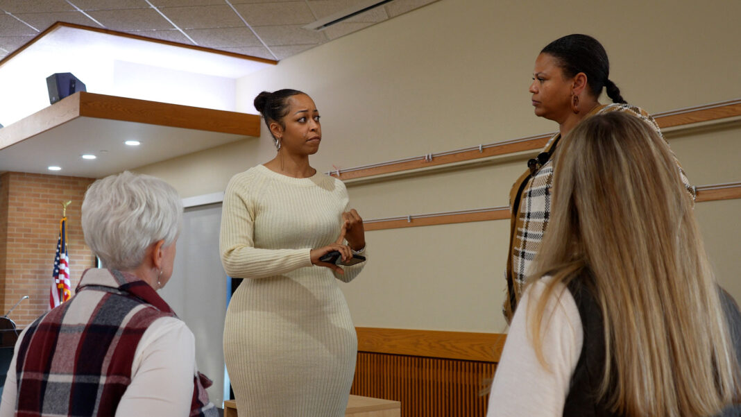 Four people having a conversation