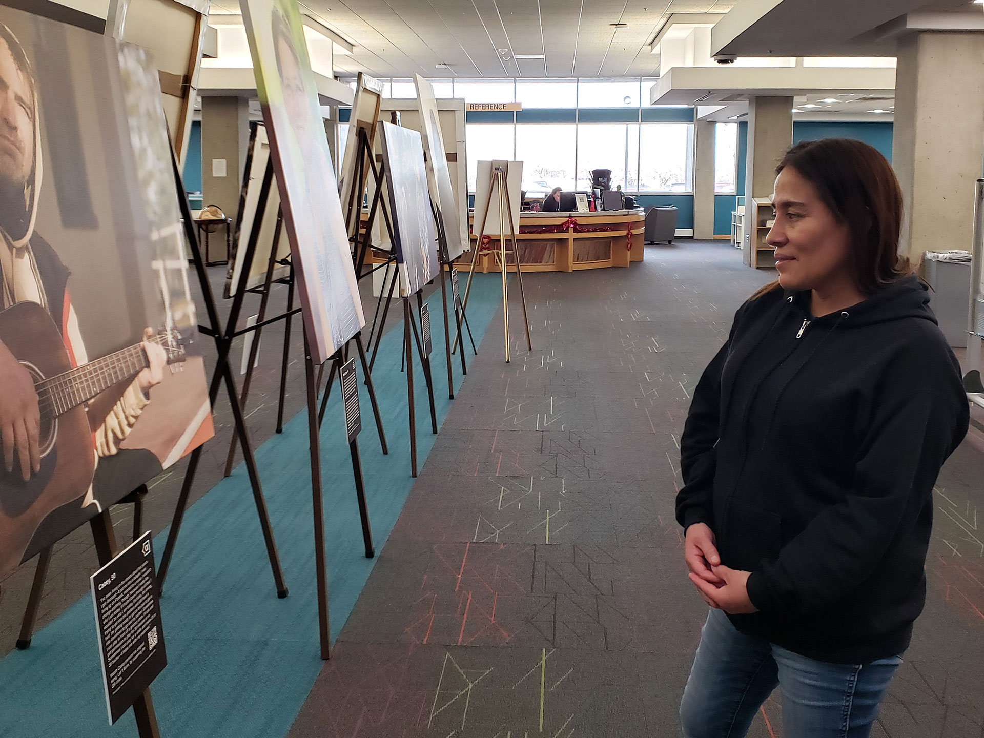 Visitor looking at a photography exhibit