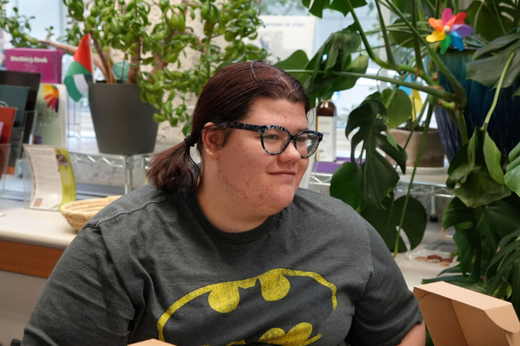 Lyn smiling while visiting with other guests