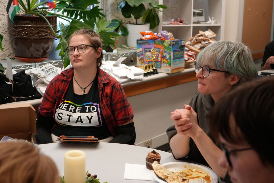 Iris and Jack visiting with other guests at a table