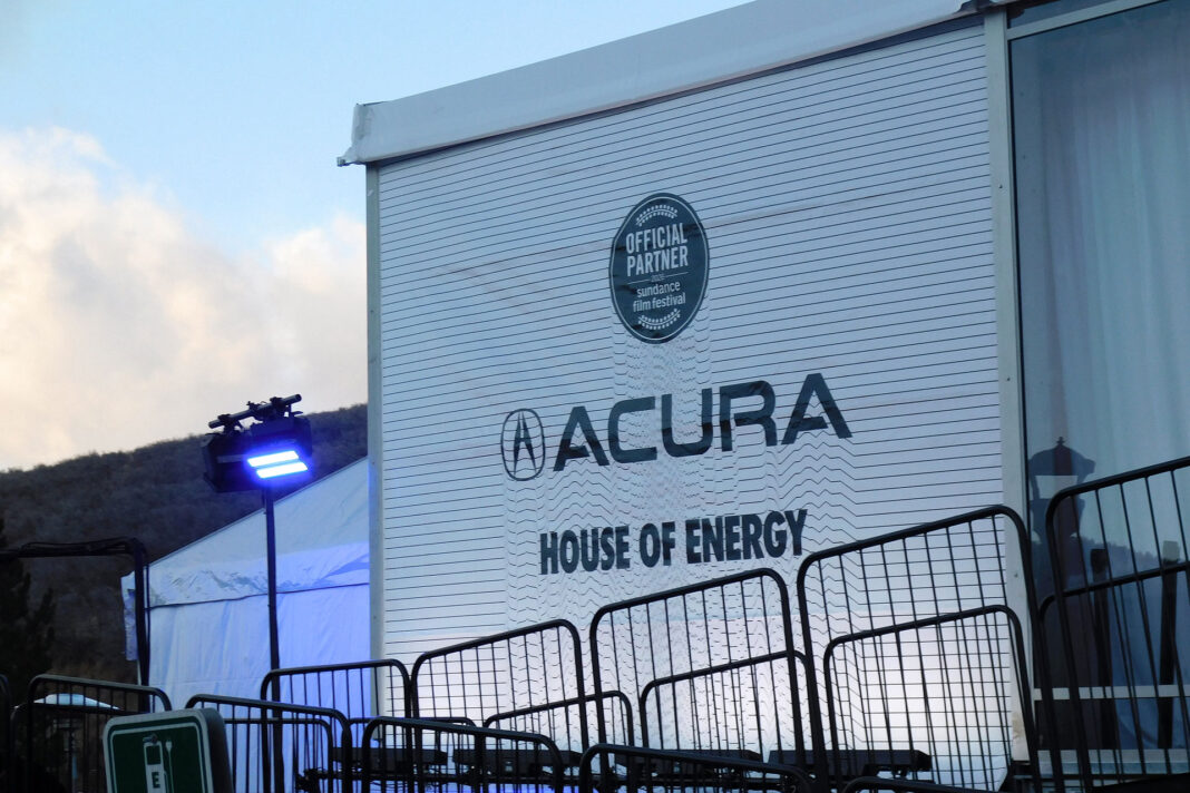 "Acura House of Energy" printed on a large outdoor banner