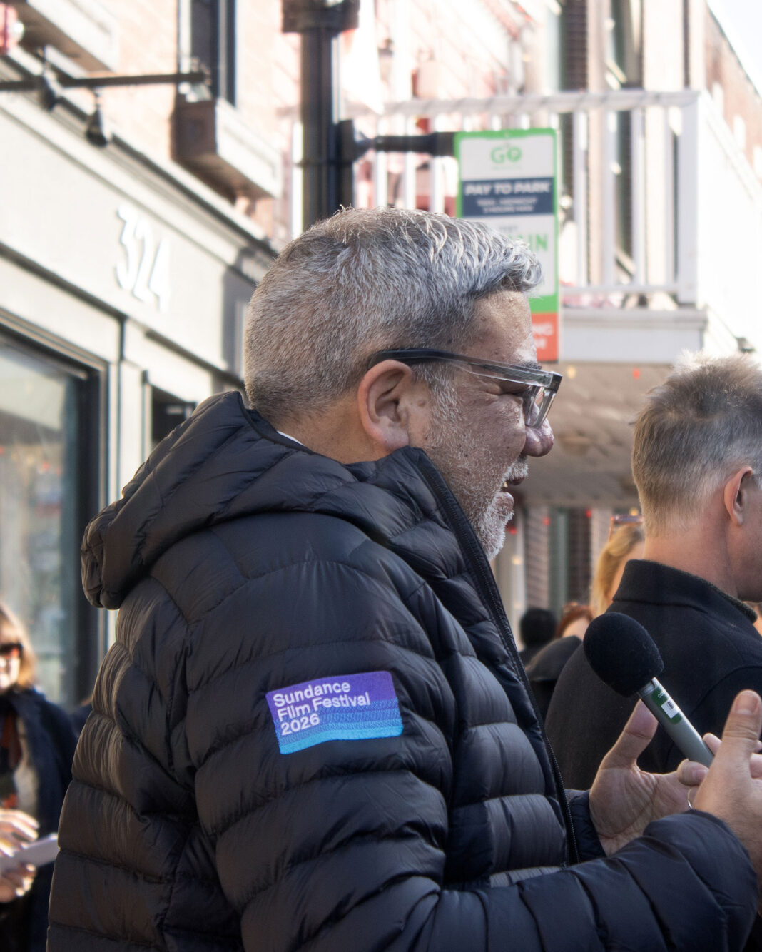 Eugene Hernandez talking to a reporter