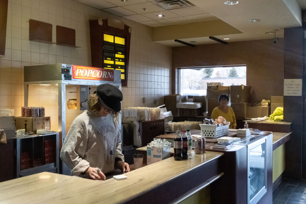 People working behind a concessions counter