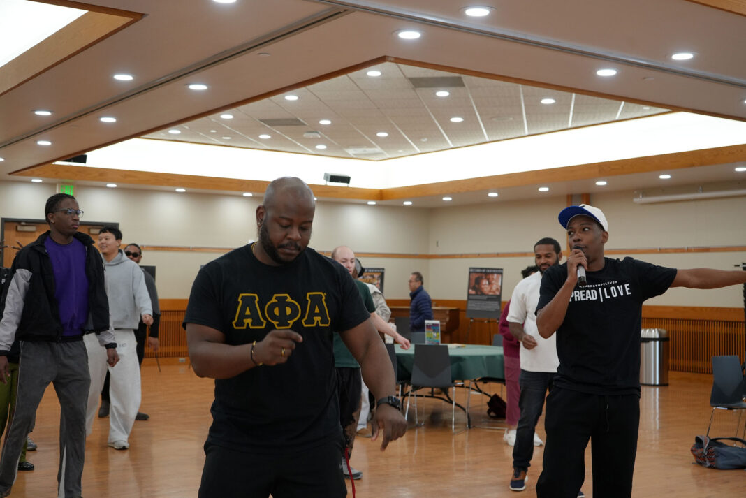 LaDonte leading a dance lesson as participants follow along