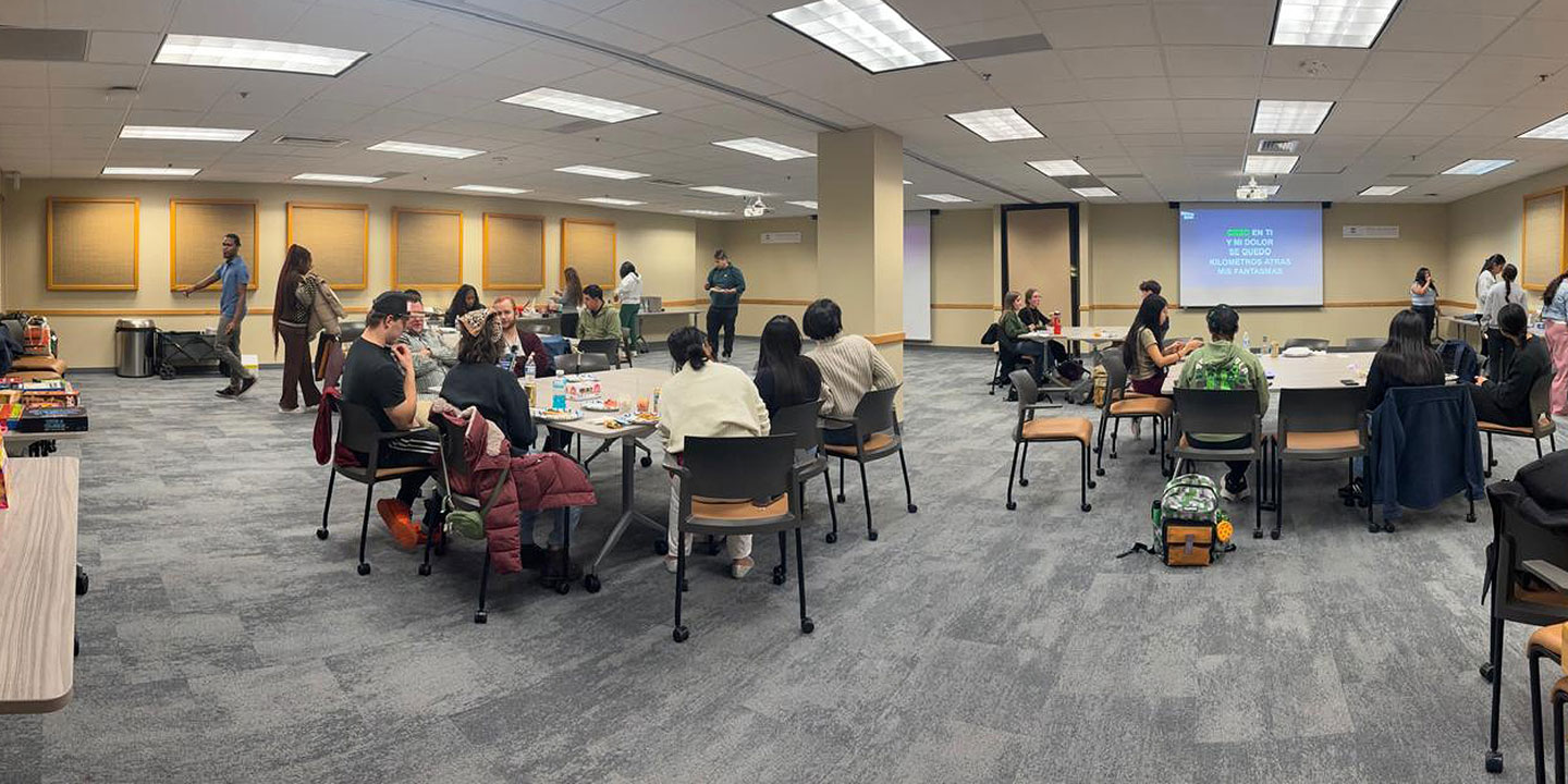 People socializing inside Dens 1 and 2 of the Student Center