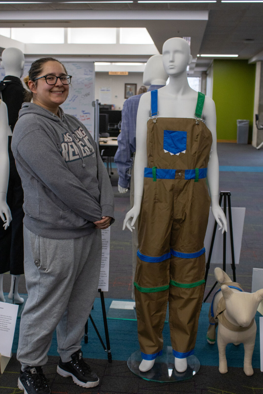 Carolina posing with her fashion designs