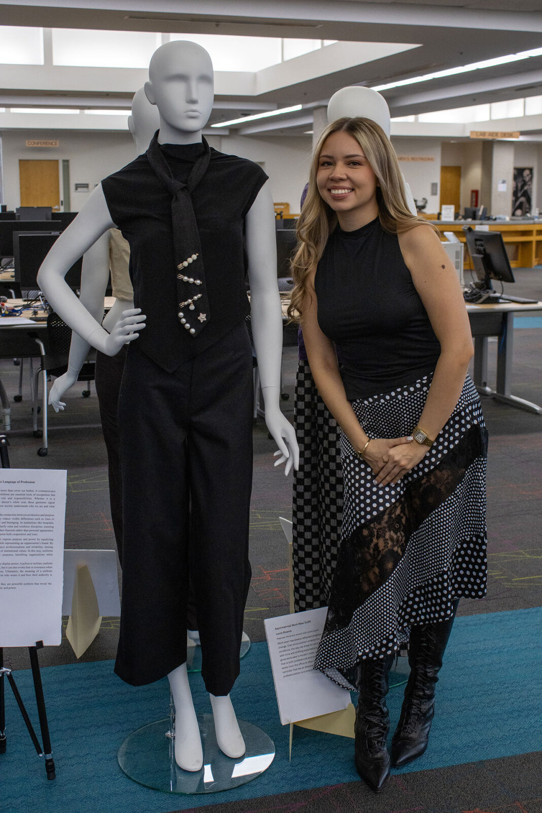 Laura posing with her fashion design