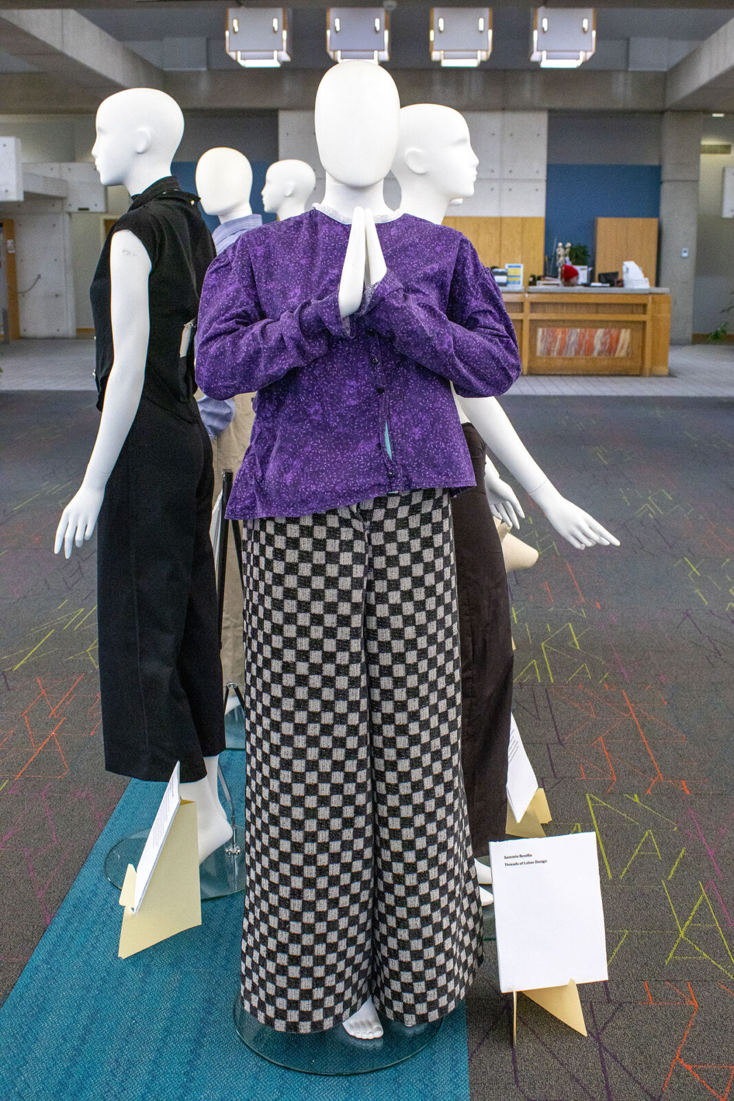Mannequins wearing student fashion designs