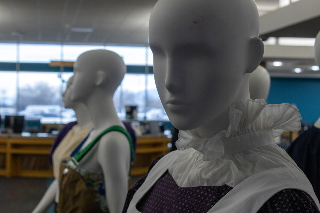 Mannequins wearing clothing designs created by students