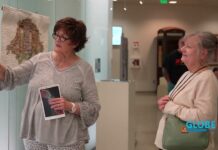 Globe News – March 18, 2026 Rosanna Lynne Welter discussing quilted art with a guest attendee