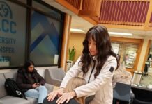 Free chair massages offered to students every Monday Massage therapist working on a student's shoulders