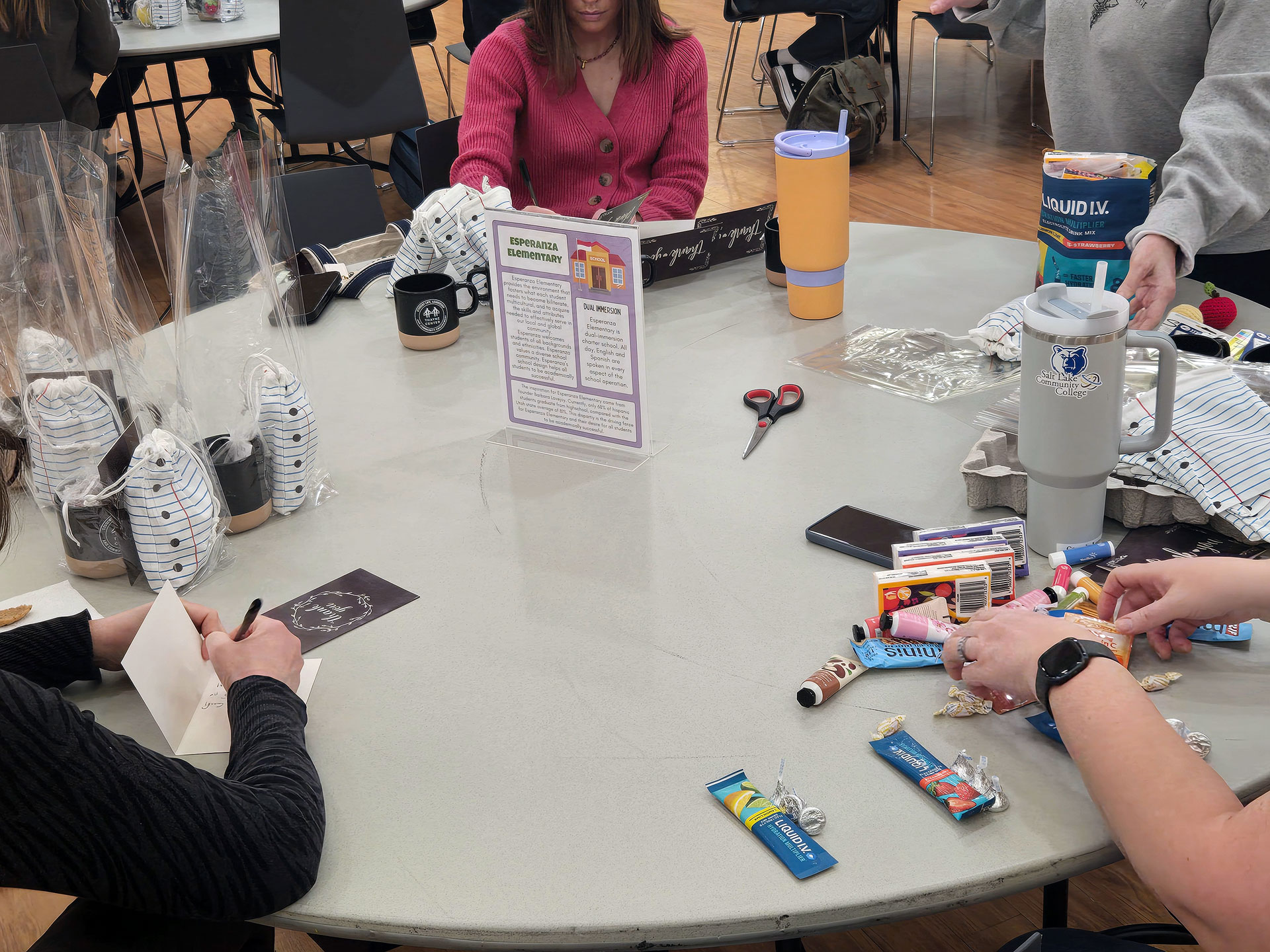 Volunteers building survival kits for teachers