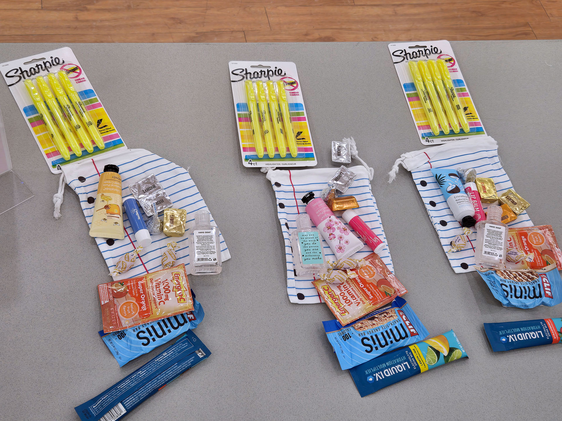 Various items collected for teacher survival kits sitting on a table