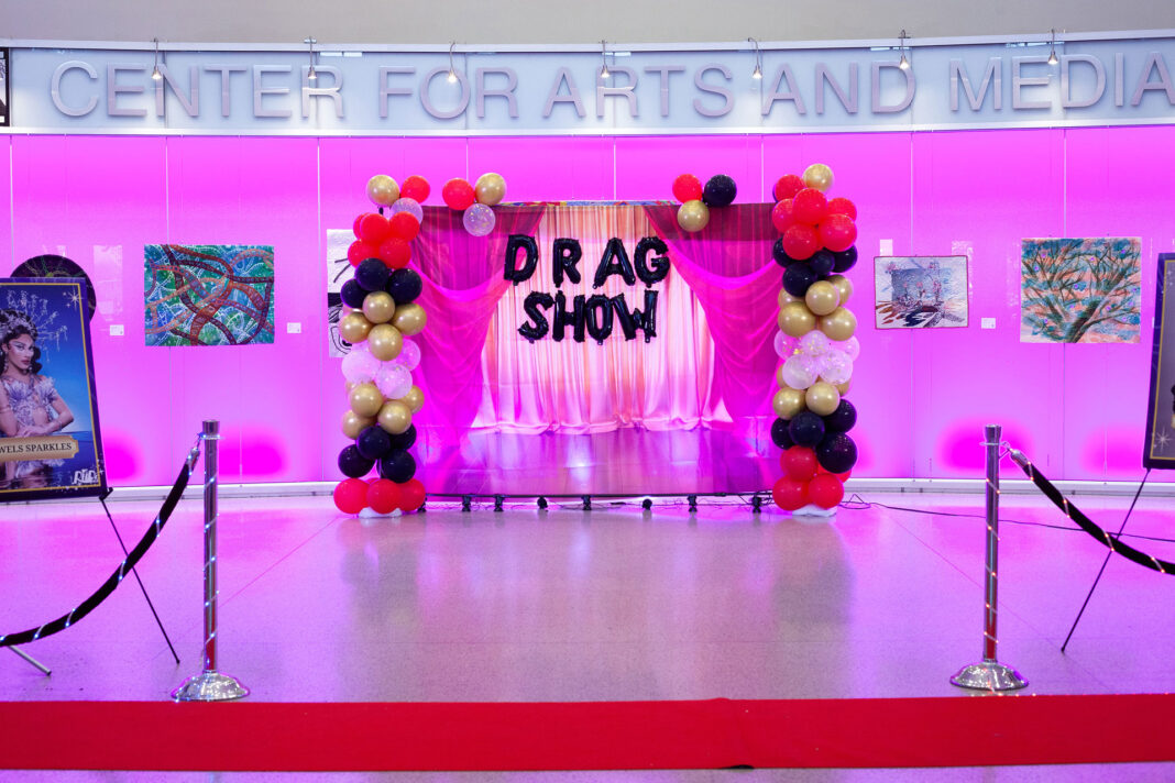 Drag show red carpet and balloon display inside the CAM foyer