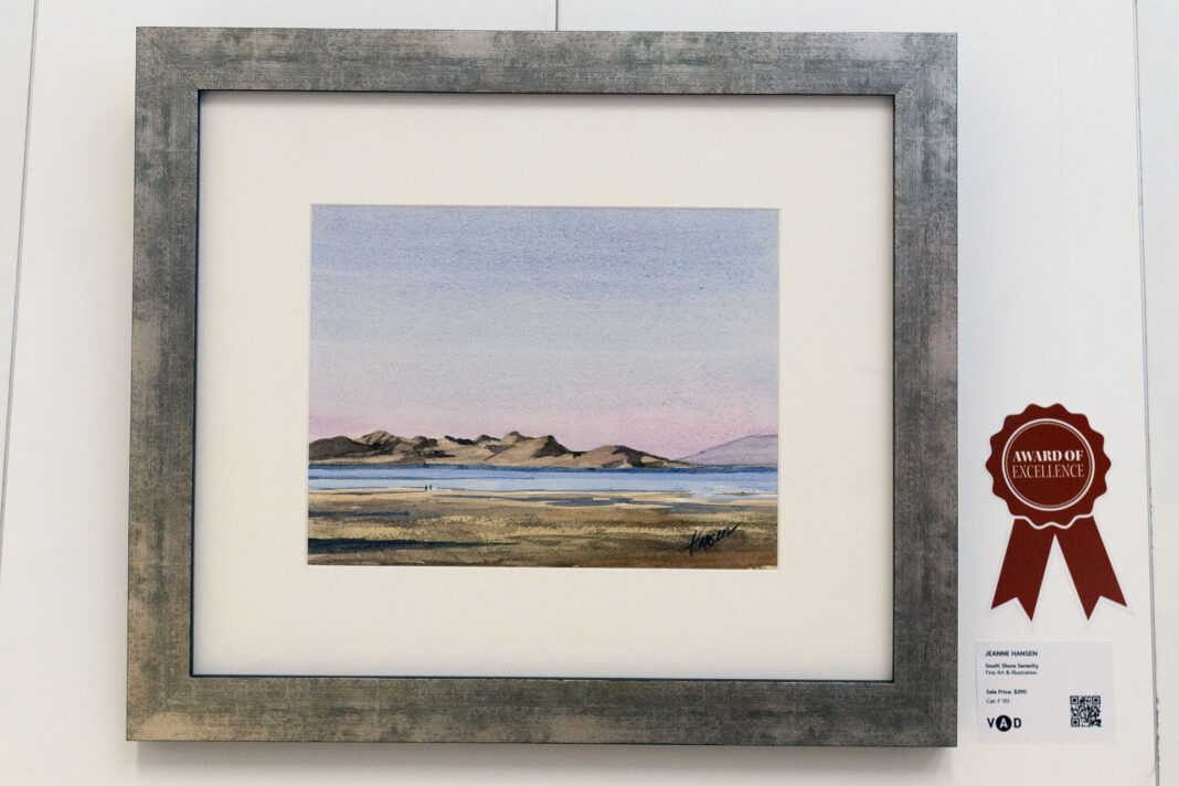 A framed illustration of a lake landscape painting