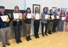 In photos: The Annual SLCC Student Art Showcase Artists standing in line holding their awards