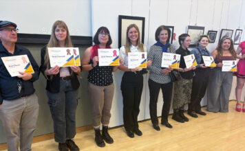 In photos: The Annual SLCC Student Art Showcase Artists standing in line holding their awards