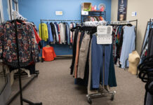 Resource roundup: A guide to SLCC’s free student services Clothes hanging on racks inside a room