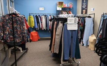 Resource roundup: A guide to SLCC’s free student services Clothes hanging on racks inside a room