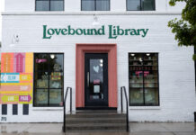 Exploring indie bookstores in Salt Lake City White painted brick building with Lovebound Library in green