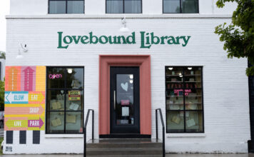 Exploring indie bookstores in Salt Lake City White painted brick building with Lovebound Library in green