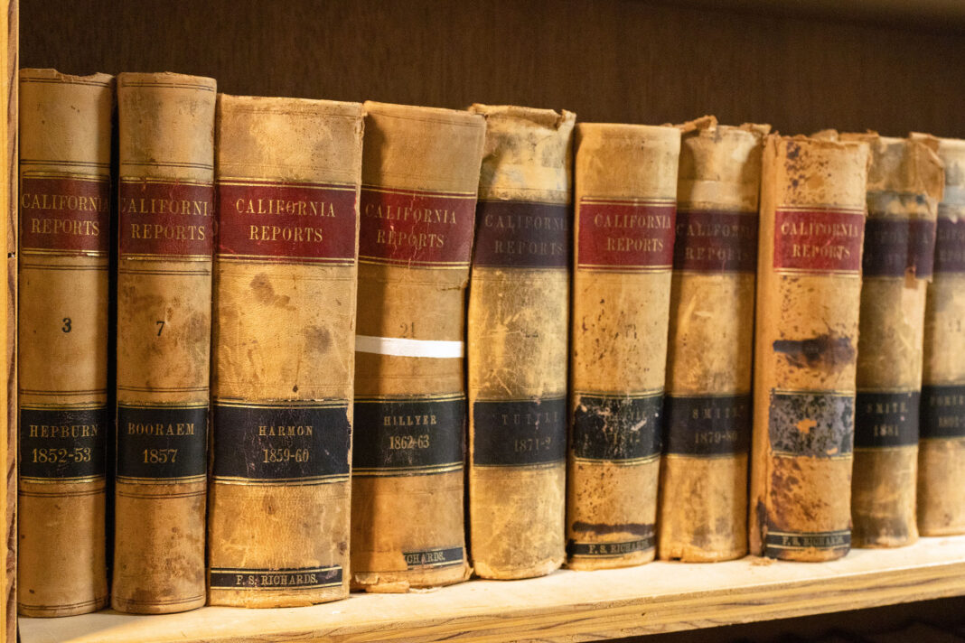 A row of 19th century California Reports lining a bookshelf