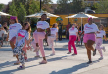 SLCC student clubs require planning and collaboration Several people dancing outside in a courtyard