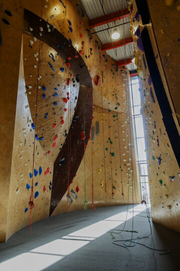 Climbing wall decorated with holding spots in different colors
