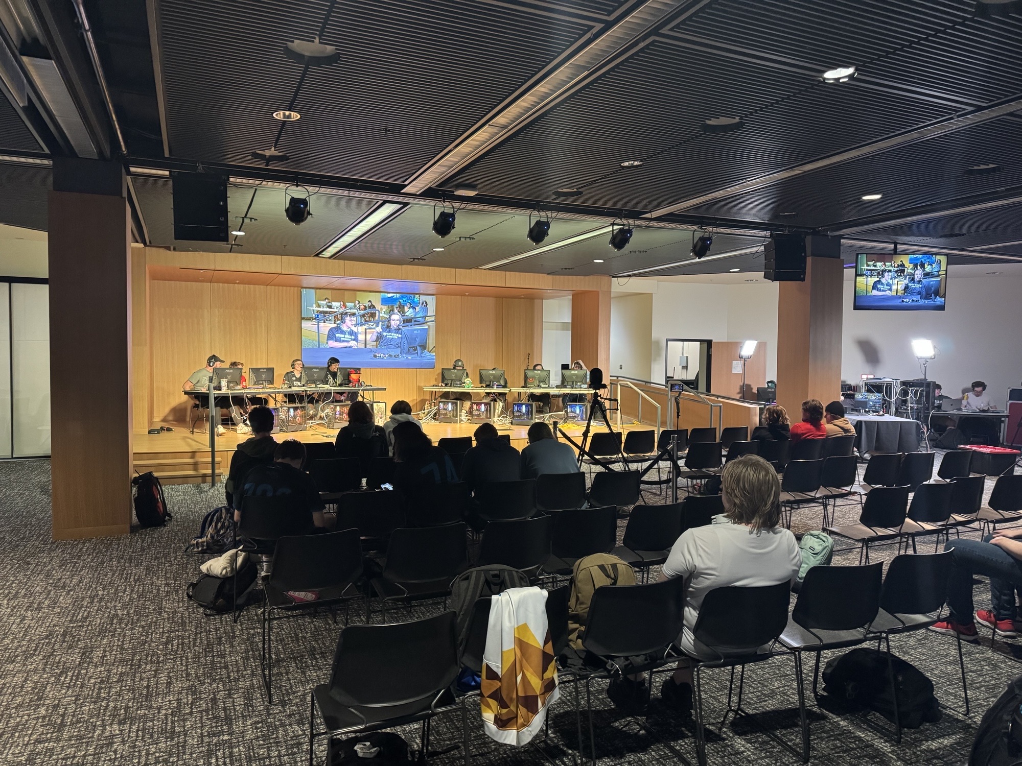 esports teams playing head-to-head in front of seated audience
