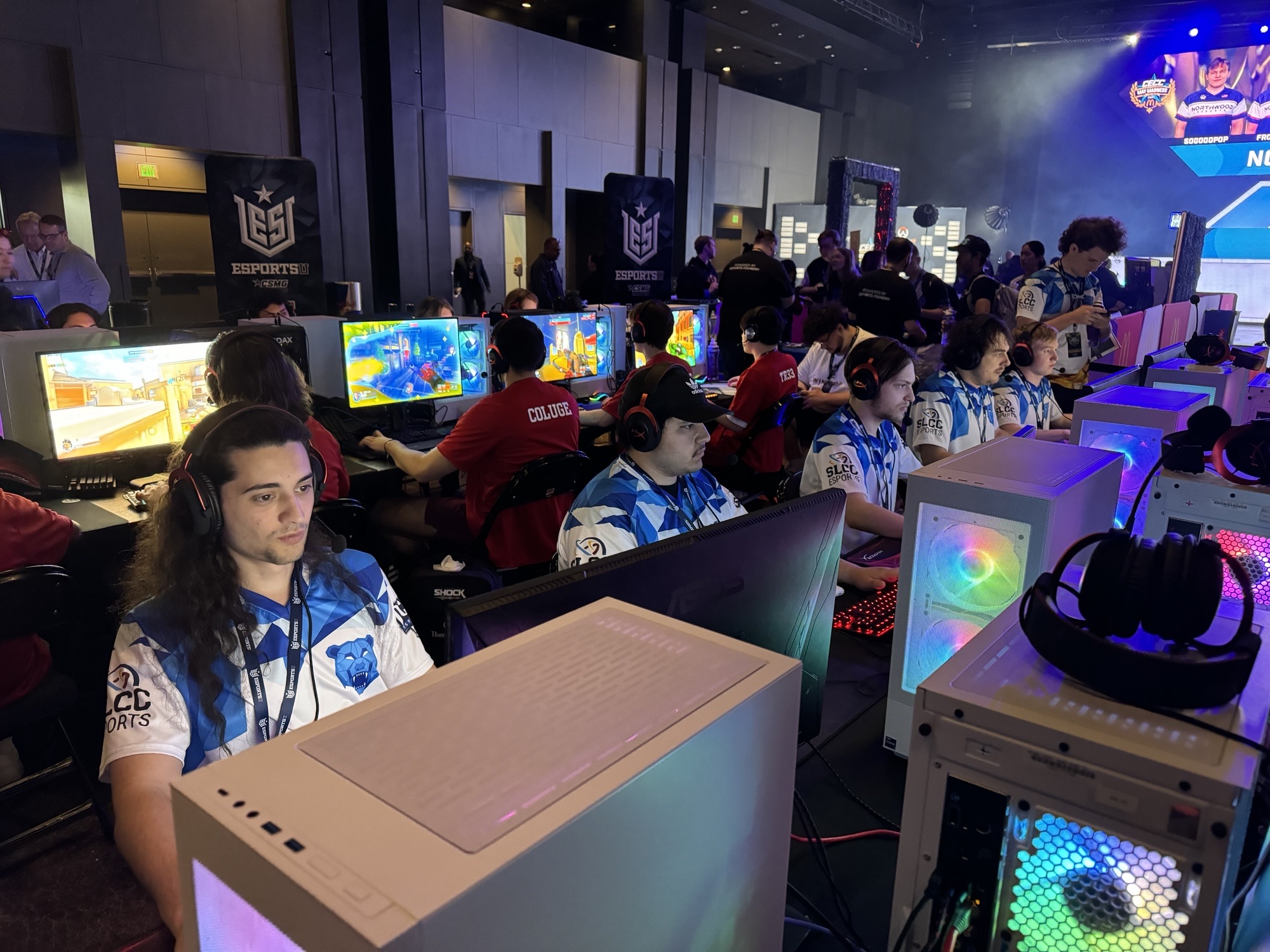 People playing computer games during an esports tournament