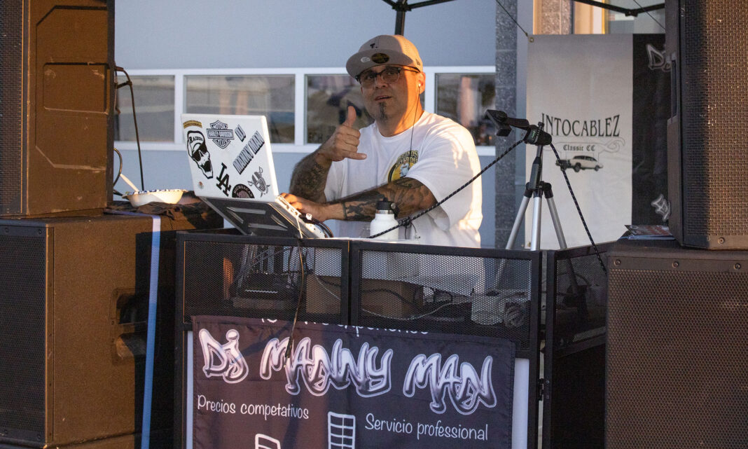 DJ posing while playing music on his rig