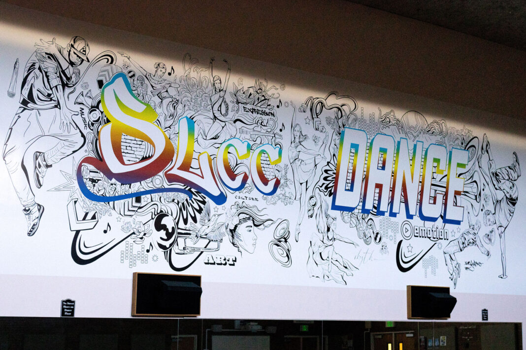 Large mural with the words "SLCC Dance" outlined in rainbow colors
